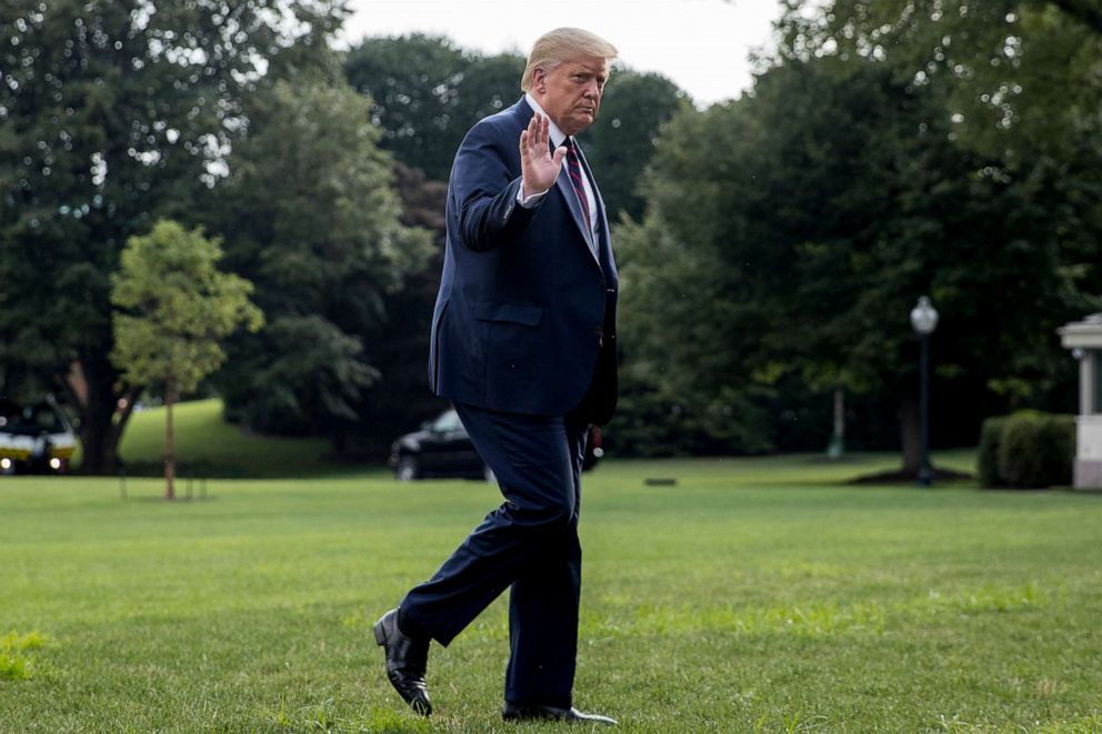 PHOTO: President Donald Trump waves to members of the media as he arrives on the South Lawn of the White House in Washington, July 27, 2020, after traveling to Morrisville, N.C.
