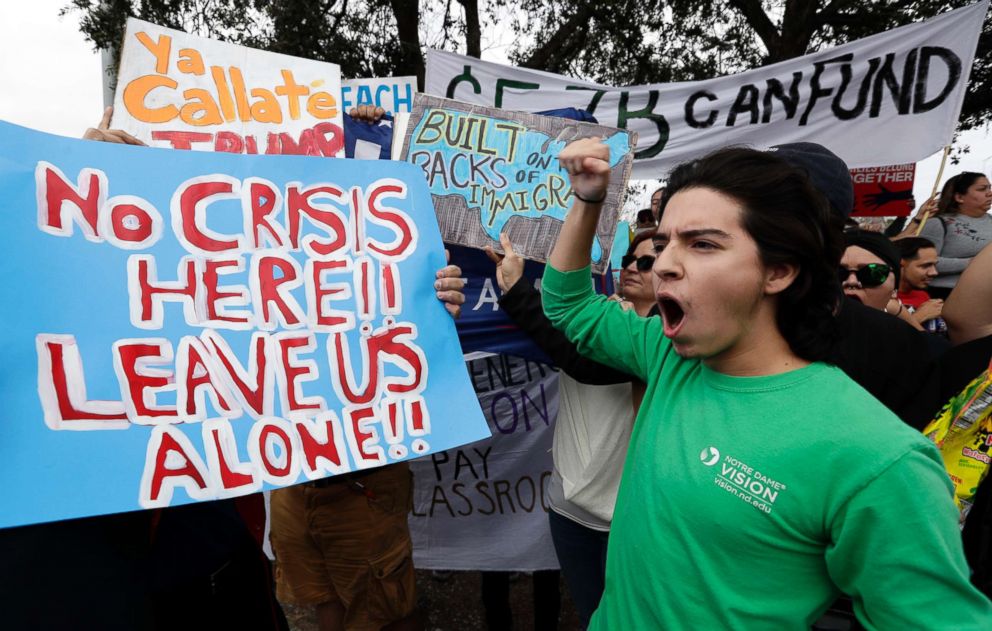 PHOTO: Groups opposed to border walls being built along the Texas-Mexico border gather outside the McAllen International Airport as they wait for the arrival of President Donald Trump, Jan. 10, 2019, in McAllen, Texas.