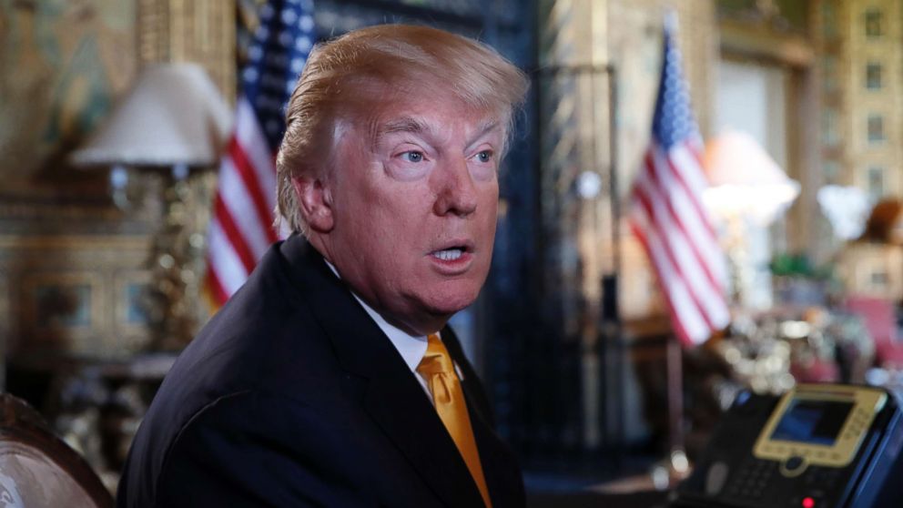 President Donald Trump speaks to the media before speaking with troops via video conference at Mar-a-Lago, on Thanksgiving, Nov. 23, 2017, in Palm Beach, Fla.