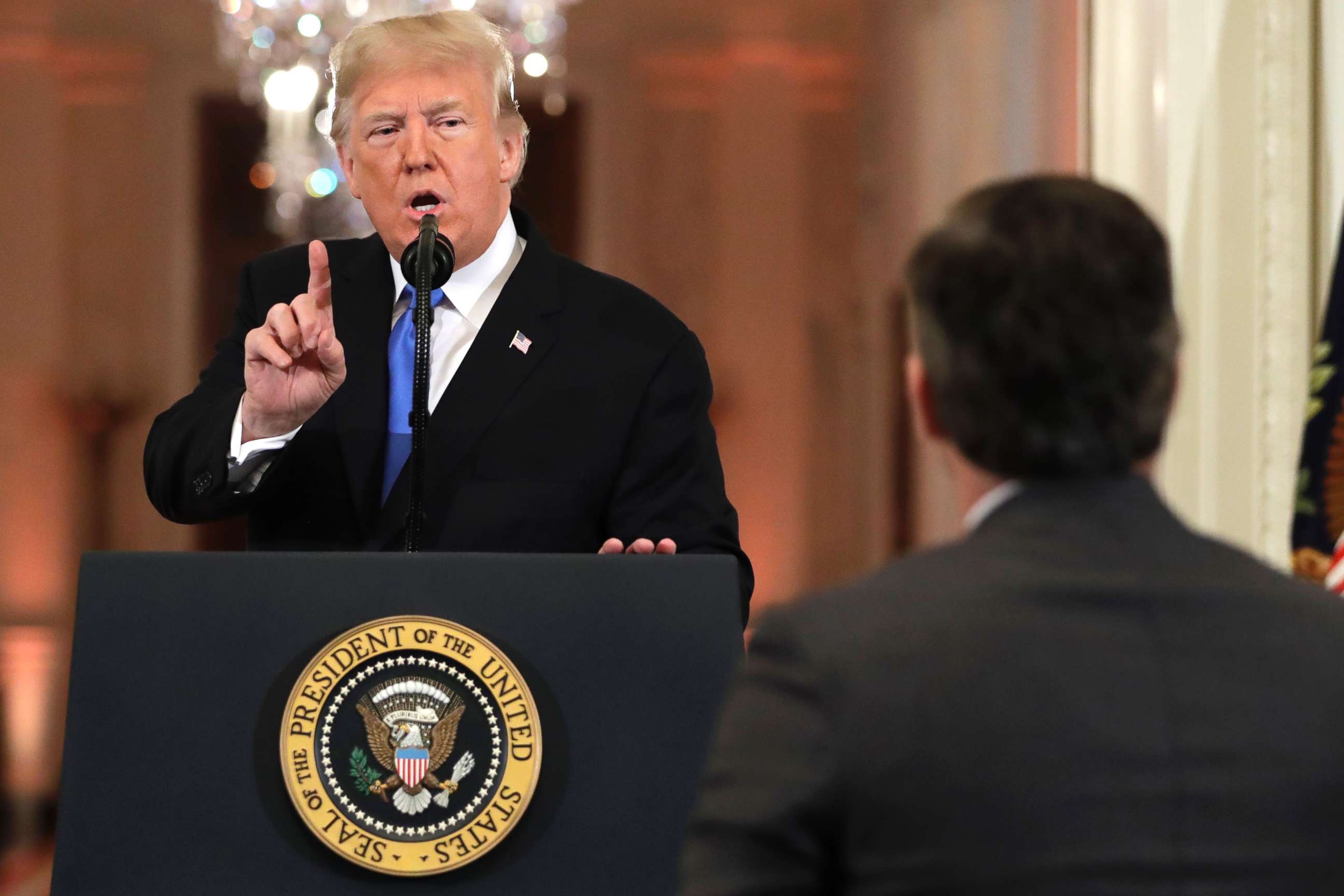PHOTO: President Donald Trump speaks as CNN's Jim Acosta, standing at right, listens, during a news conference in the East Room of the White House, Nov. 7, 2018, in Washington.