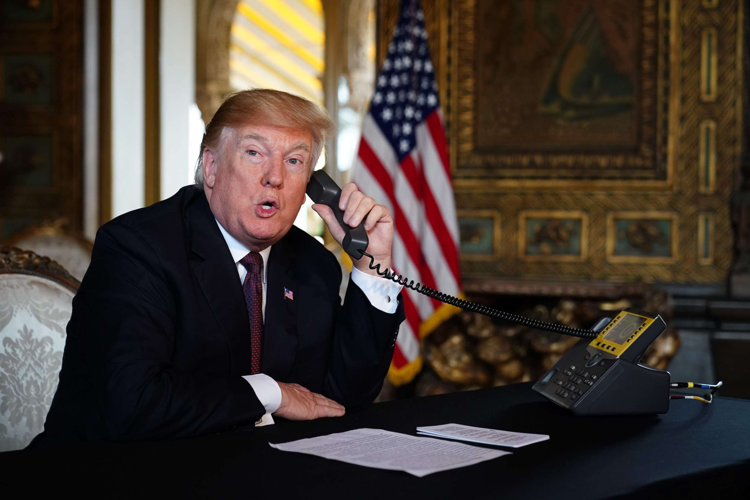 PHOTO: President Donald Trump speaks to members of the military via teleconference from his Mar-a-Lago resort in Palm Beach, Fla., on Thanksgiving Day, Nov. 22, 2018.