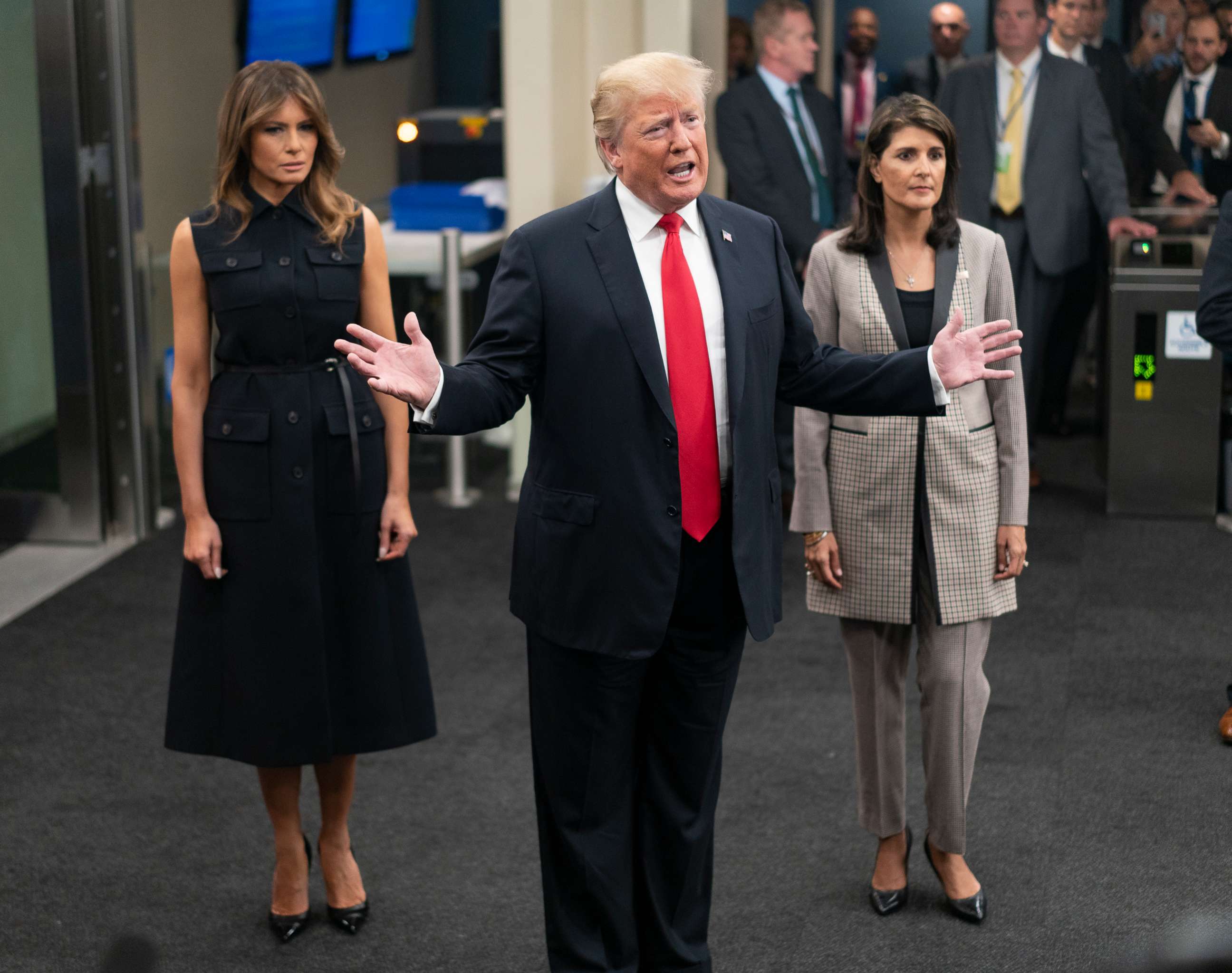 PHOTO: President Donald Trump addresses members of the news media as he arrives with First lady Melania Trump, left, and Nikki Haley, the U.S. ambassador to the United Nations, Sept. 25, 2018.
