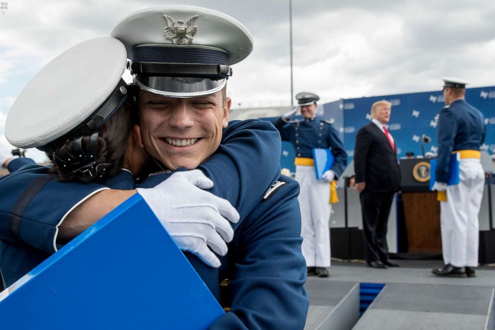 PHOTO: Cadets celebrate as they receive their diplomas and shake hands with President Donald Trump during the 2019 United States Air Force Academy Graduation Ceremony at Falcon Stadium, May 30, 2019.