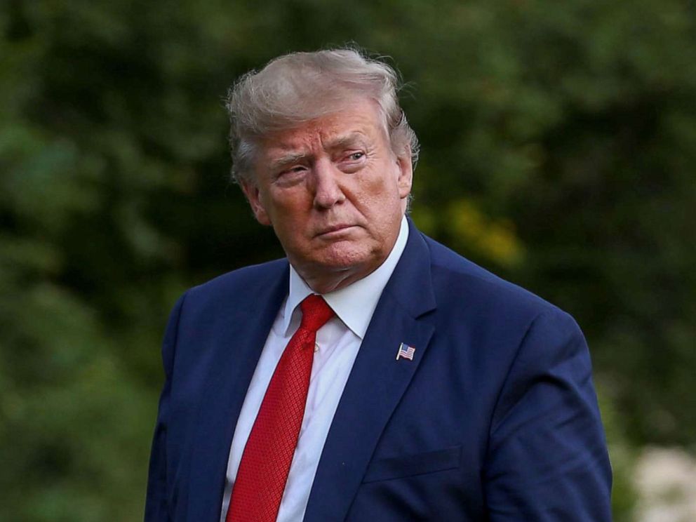 PHOTO: President Donald Trump walks on the South Lawn of the White House after returning from a trip to Kentucky, in Washington, Aug. 21, 2019.