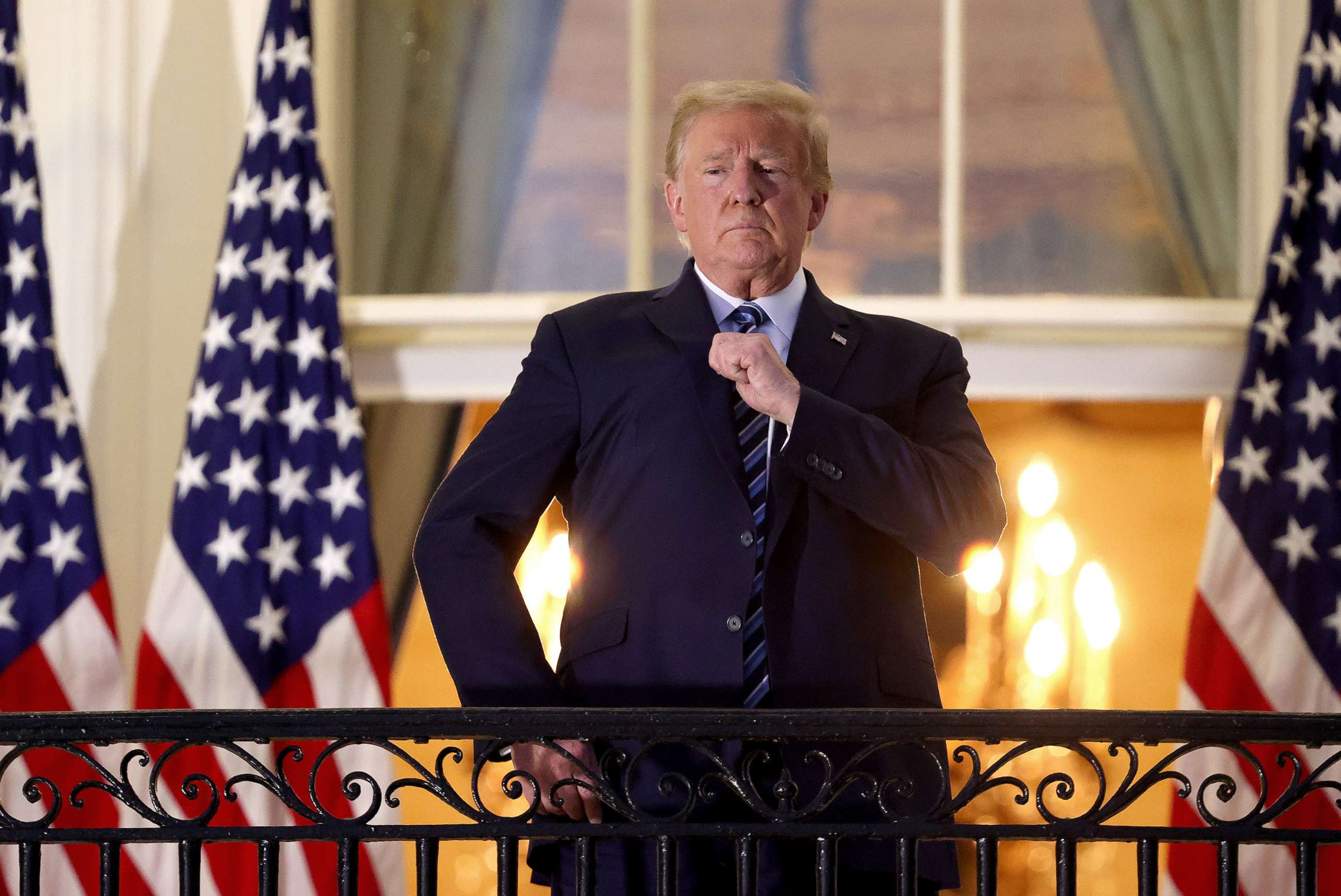 PHOTO: President Donald Trump gestures on the Truman Balcony after returning to the White House from Walter Reed National Military Medical Center on Oct. 5, 2020, in Washington.