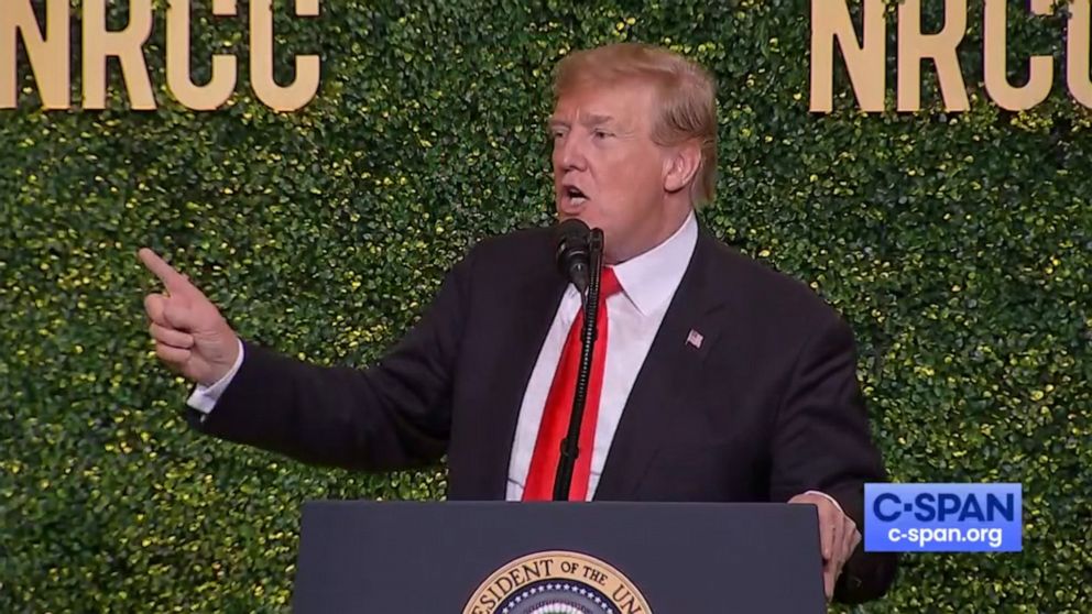 PHOTO: President Donald Trump mimics the movement of a windmill while delivering his speech at the NRCC Spring Dinner in Washington, April 2, 2019.