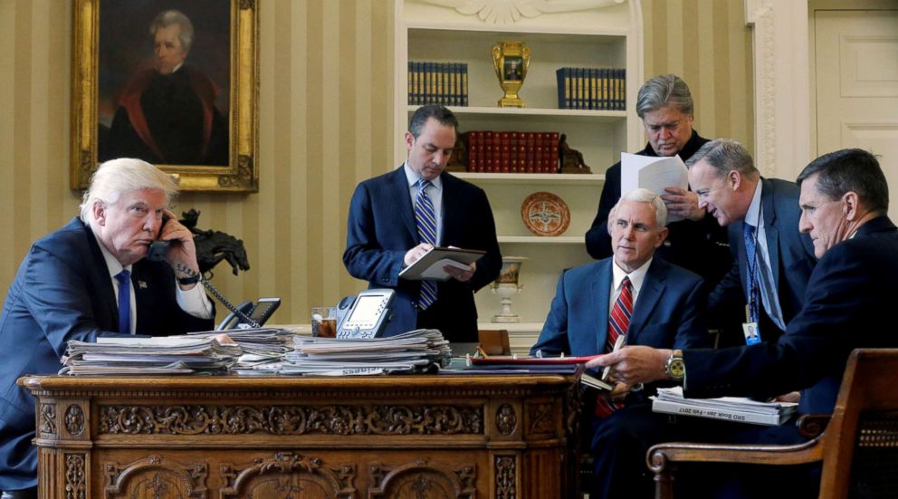 President Donald Trump, joined by Chief of Staff Reince Priebus, Vice President Mike Pence, Senior Advisor Steve Bannon, Communications Director Sean Spicer and National Security Advisor Michael Flynn, speaks with President Vladimir Putin, Jan. 28, 2017.