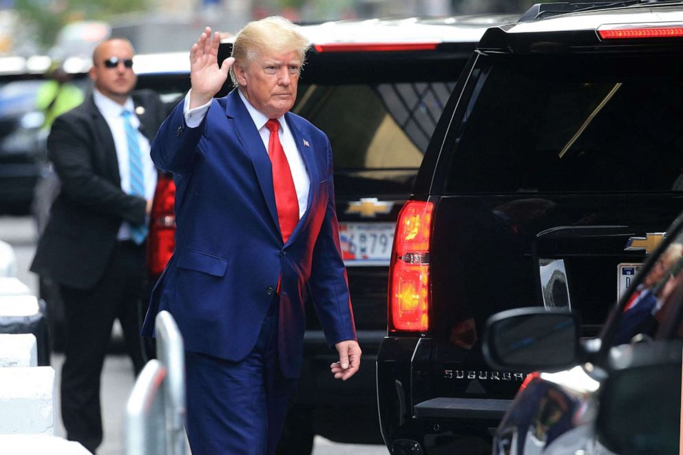 PHOTO: Former President Donald Trump waves while walking to a vehicle in New York City on Aug. 10, 2022.