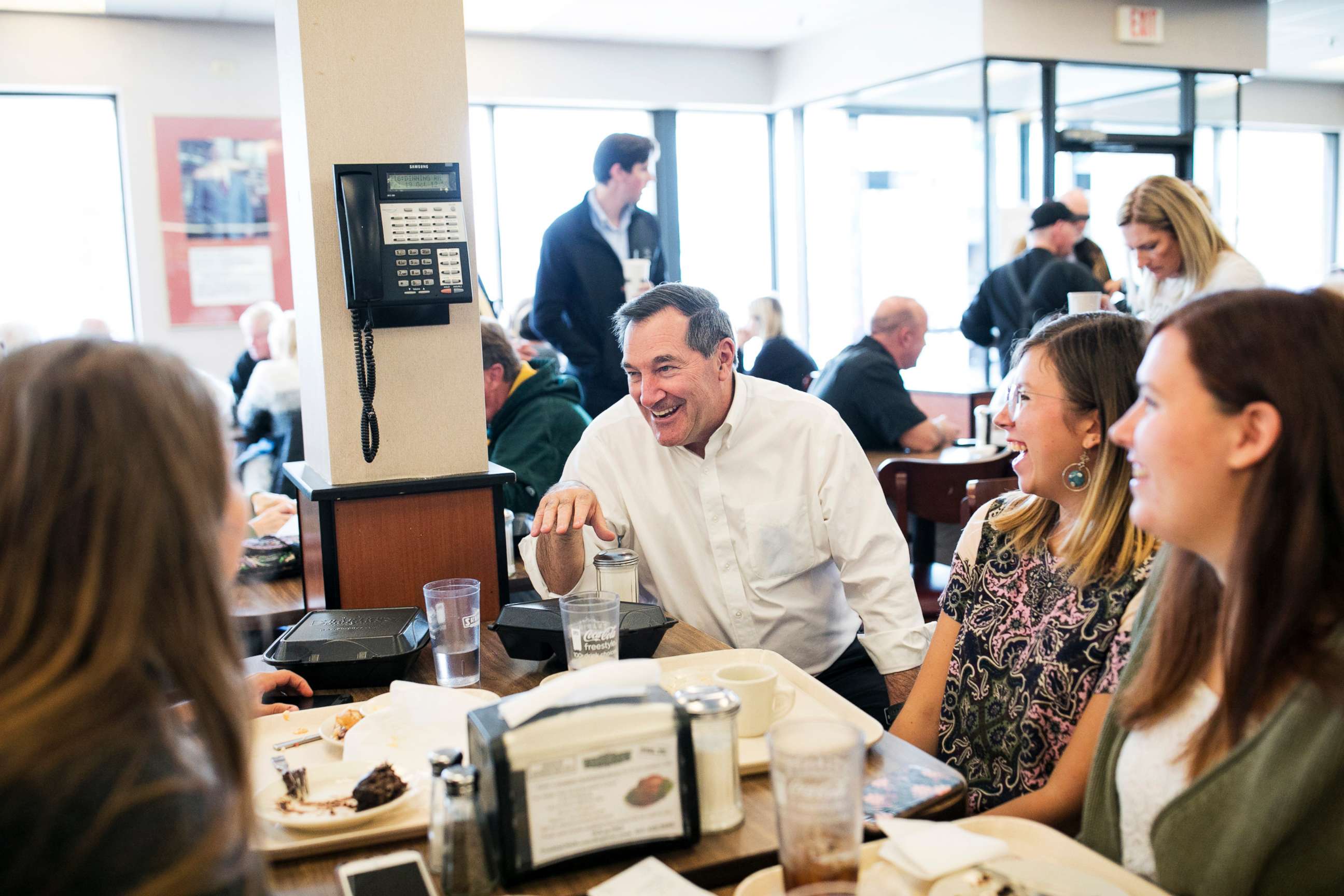 PHOTO: Sen. Joe Donnelly (D-Ind.) talks with people at Shapiro's Delicatessen in Indianapolis, Ind., Oct. 18, 2018. 