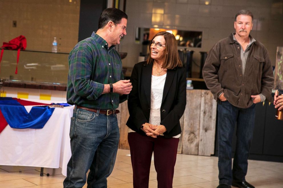 PHOTO: Rep. Martha McSally, a Republican who is running for Senate, and Gov. Doug Ducey, who is running for re-election, speak before a pancake breakfast with supporters in a mall in Prescott, Ariz., Nov. 4, 2018.