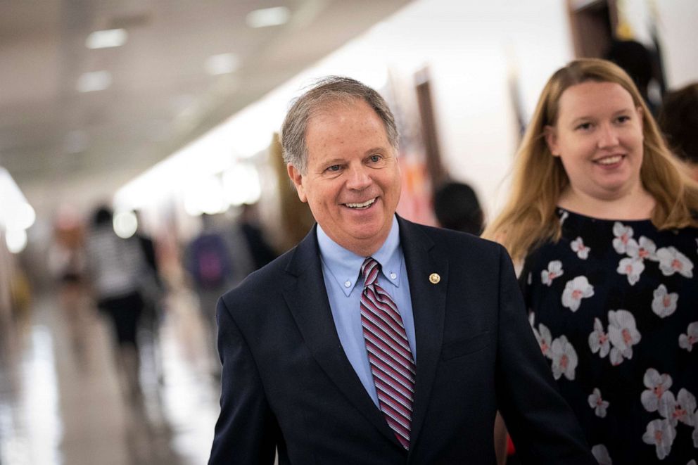 PHOTO: Sen. Doug Jones walks through the Dirksen Senate Office Building on Capitol Hill, Sept. 25, 2018 in Washington, D.C.