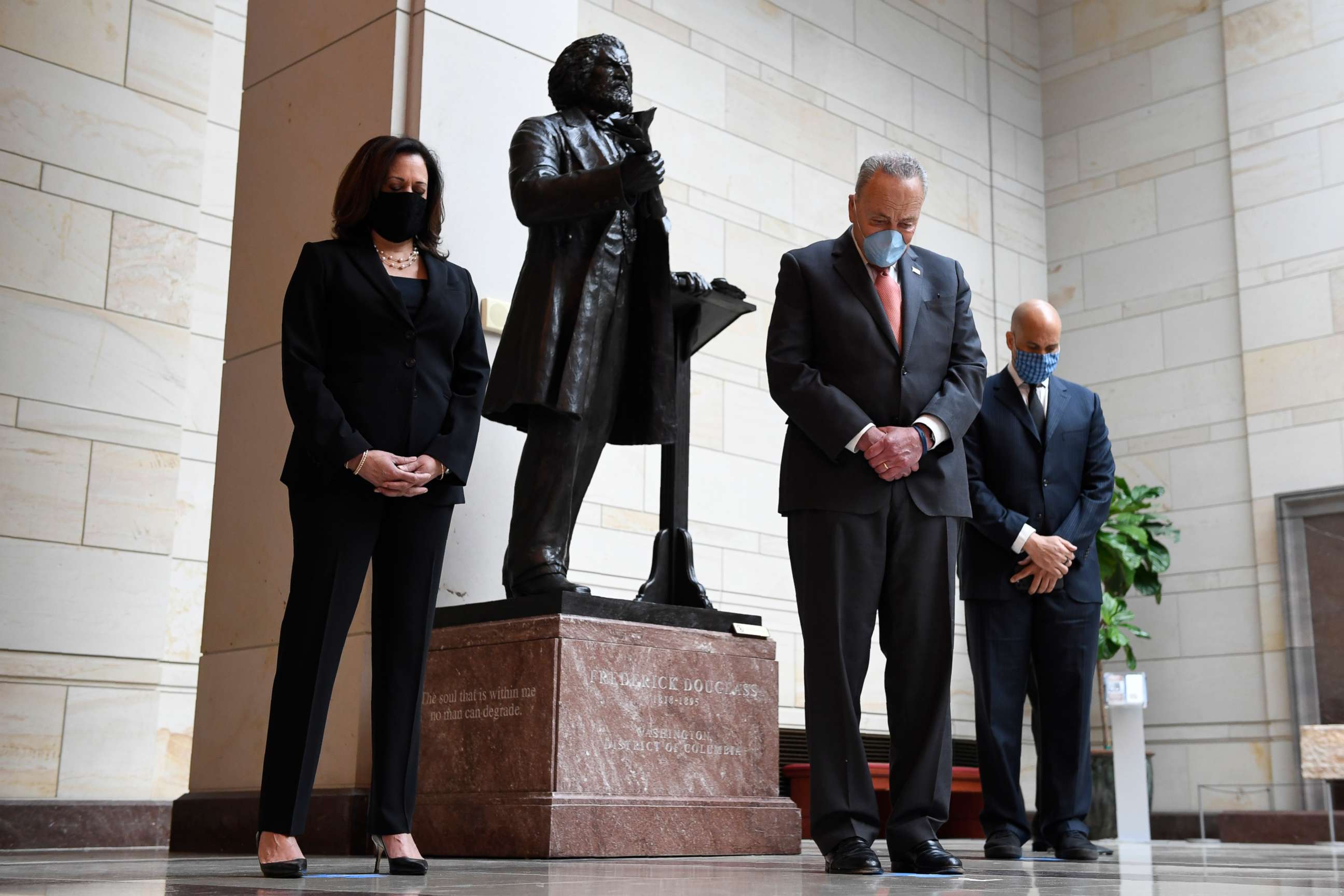 PHOTO: Standing near a statue of Frederick Douglass, Sen. Kamala Harris, D-Calif., left, Senate Minority Leader Sen. Chuck Schumer of N.Y., center, and Sen. Cory Booker, D-N.J., right, pause during a prayer on Capitol Hill in Washington, June 4, 2020.