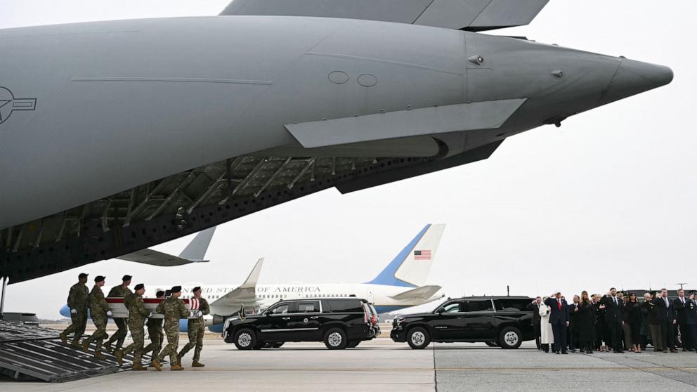 PHOTO: Members of a US Army team carry a flagged-drapped transfer case containing the remains of US soldier Capt. Cody A. Khork during a dignified transfer solemn event at Dover Air Force Base, in Dover, Delaware, on March 7, 2026.