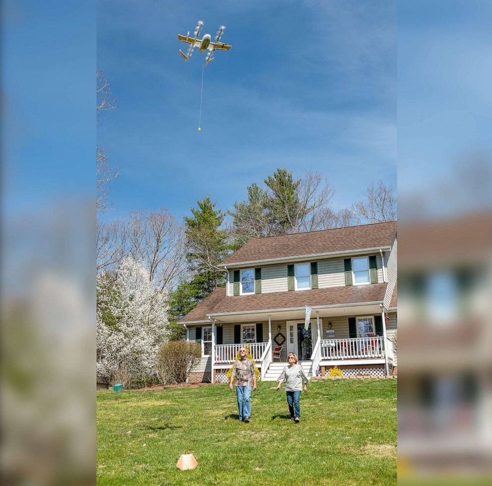 PHOTO: A Virginia family receives an air delivery by drone as part of Wing's validation testing with the FAA in an undated handout photo.