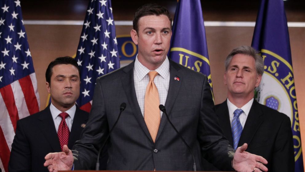 In this April 7, 2011 file photo, U.S. Rep. Duncan Hunter, R-Calif., center, speaks during a news conference on Capitol Hill.
