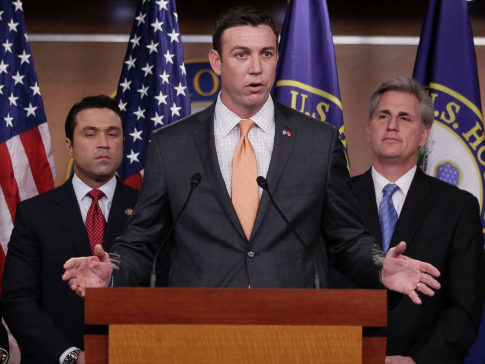 In this April 7, 2011 file photo, U.S. Rep. Duncan Hunter, R-Calif., center, speaks during a news conference on Capitol Hill.
