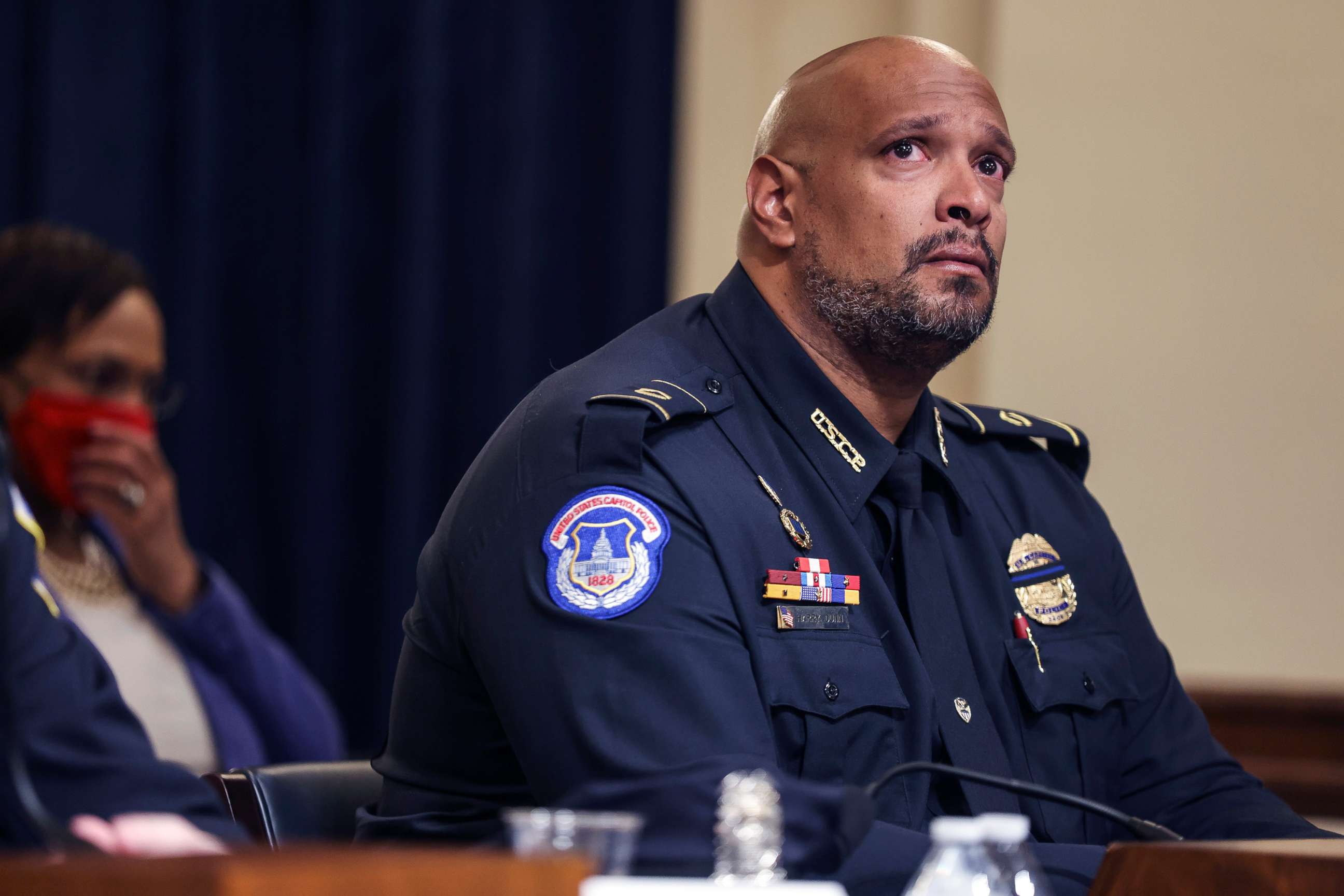 PHOTO: U.S. Capitol Police officer Harry Dunn becomes emotional as he testifies before the House Select Committee investigating the January 6 attack on the U.S. Capitol, July 27, 2021 at the Canon House Office Building in Washington, D.C.