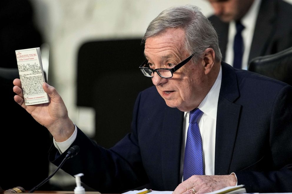 PHOTO: Senate Judiciary Committee Chairman Richard Durbin holds a copy of the U.S. Constitution as he questions Supreme Court nominee Judge Ketanji Brown Jackson during her confirmation hearing, March 23, 2022 in Washington, D.C.