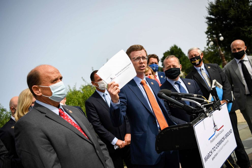 PHOTO: Rep. Dusty Johnson, joined by other members of the Problem Solvers Caucus, speaks during a news conference to unveil the "March to Common Ground", a COVID-19 relief package, at the House Triangle, Sept. 15, 2020.