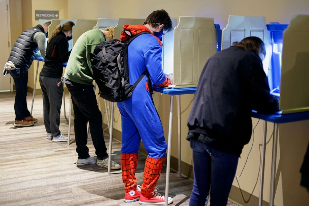 PHOTO: Colin Buckley of Omaha wears a Spiderman suit as he votes early on Halloween, at the Douglas County Election Commission office in Omaha, Neb., Oct. 31, 2020.
