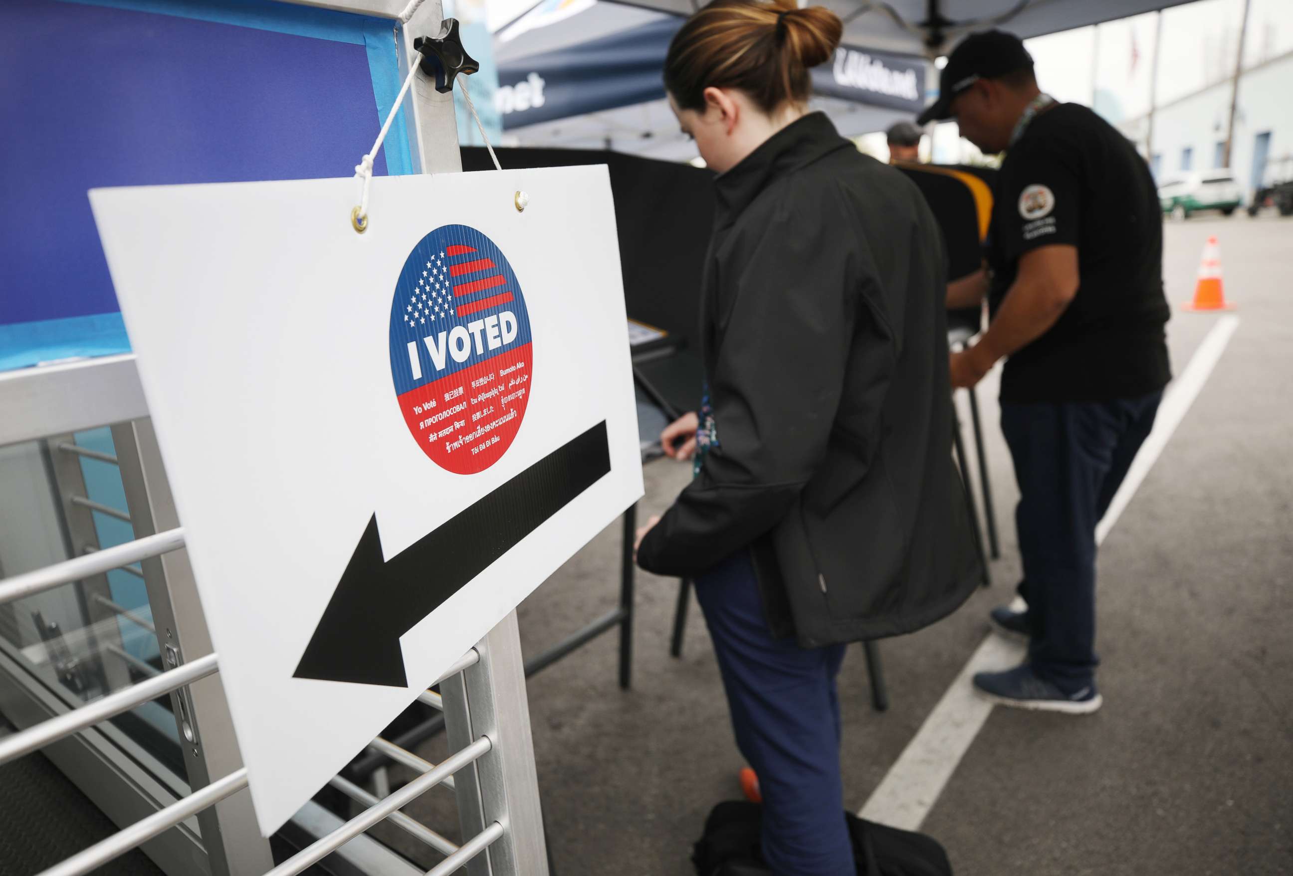 PHOTO: Voters prepare their ballots in voting booths during early voting for the California presidential primary election on Feb. 27, 2020, in Universal City, Calif.