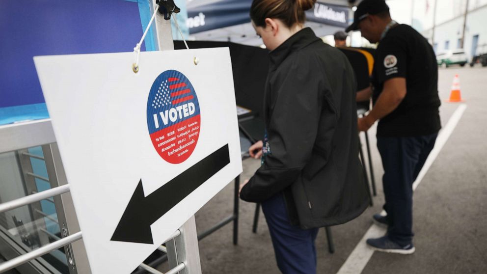 PHOTO: Voters prepare their ballots in voting booths during early voting for the California presidential primary election on Feb. 27, 2020, in Universal City, Calif.