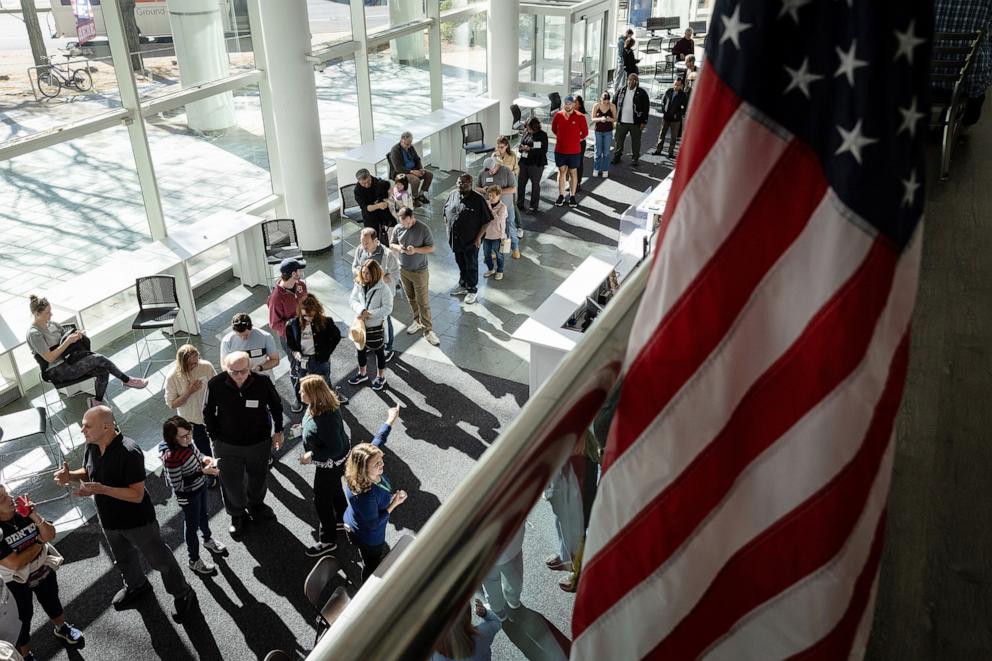 PHOTO: Voters line up to cast their ballots at the Stamford Government Center on the first day of early voting on Oct. 21, 2024, in Stamford, Connecticut.