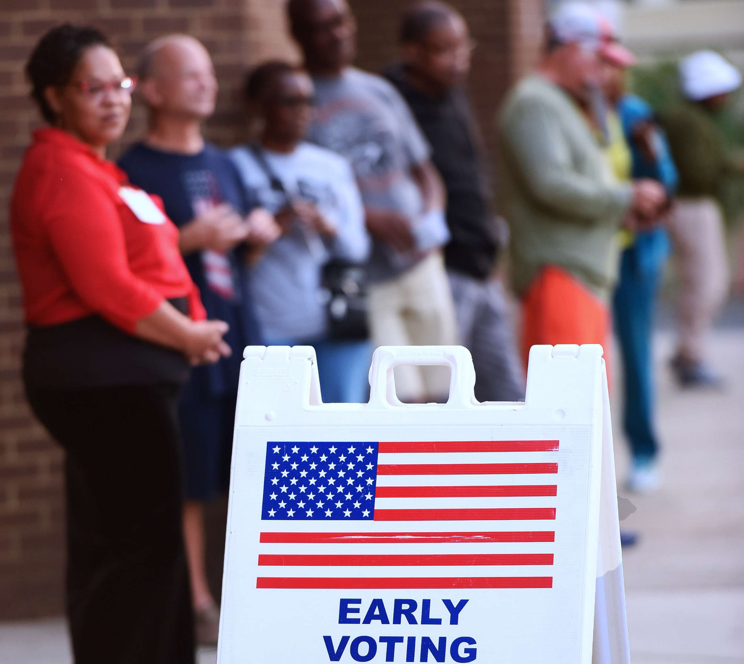 PHOTO: People wait in line to cast their ballots at the Orange County Supervisor of Elections Office on the first day of early voting for the 2022 midterm general election in Orlando, Oct. 24, 2022. 