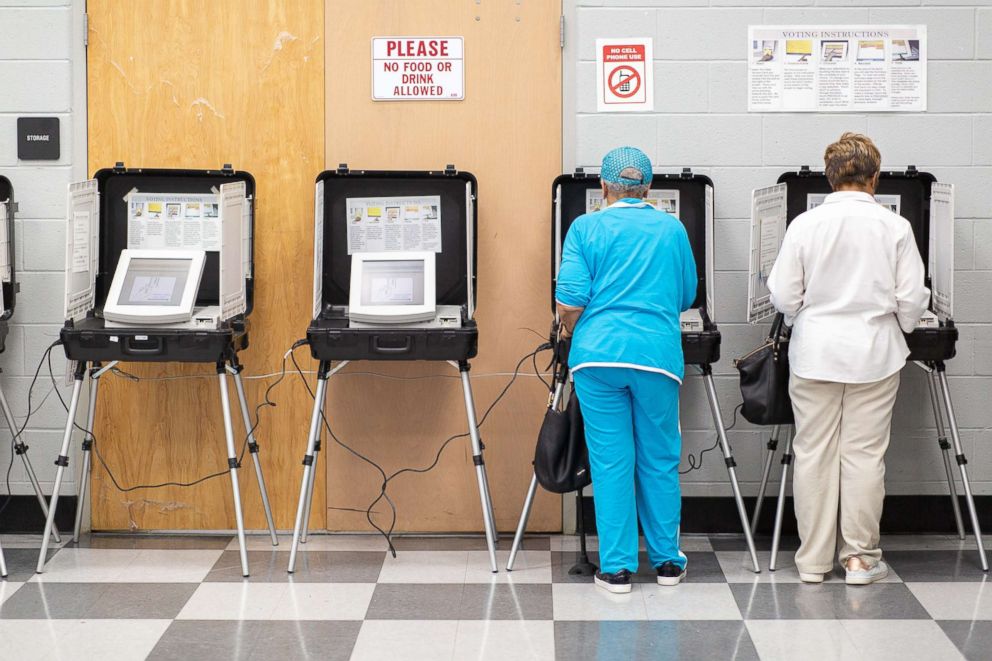 PHOTO: Voters cast ballots at a polling station open for early voting in the C.T. Martin Natatorium & Recreation Center in Atlanta, Oct. 16, 2018.