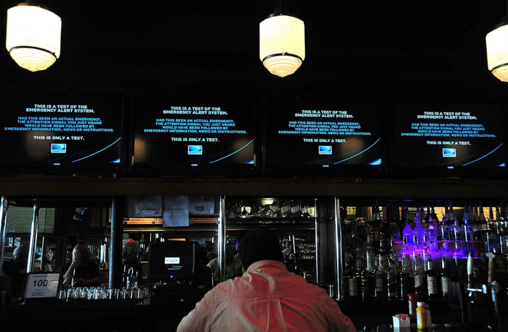 PHOTO: A man watches the new Emergency Alert System(EAS) test on November 9, 2011 in Washington.