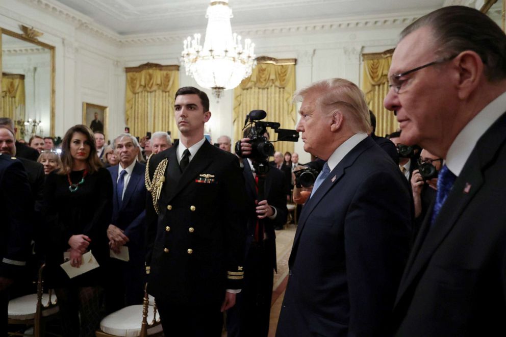 PHOTO: President Donald Trump arrives with retired four-star Army General Jack Keane for a ceremony to present Keane with the Presidential Medal of Freedom in the East Room of the White House, March 10, 2020.
