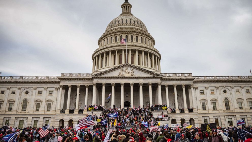 PHOTO: A large group of pro-Trump protesters stand on the East steps of the Capitol Building after storming its grounds, Jan. 6, 2021.