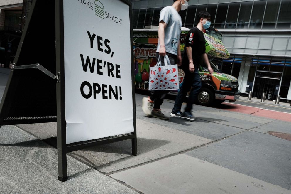 PHOTO: People walk on a street in New York City on May 04, 2021.