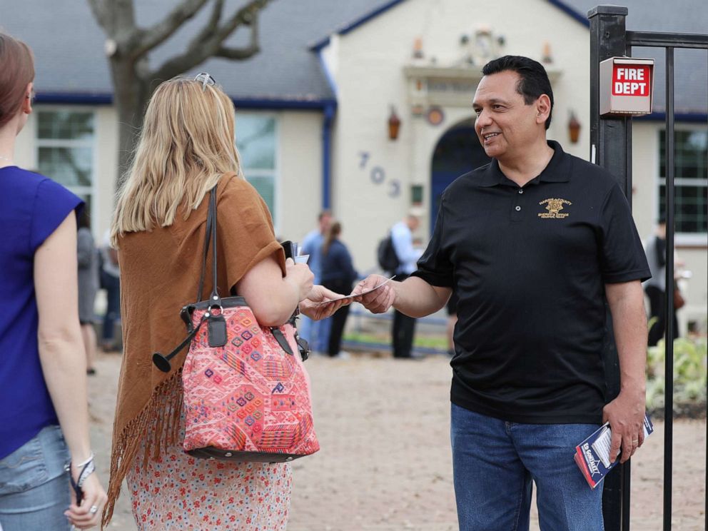 PHOTO: Sheriff Ed Gonzalez speaks to voters outside a polling station in Houston, March 3, 2020.