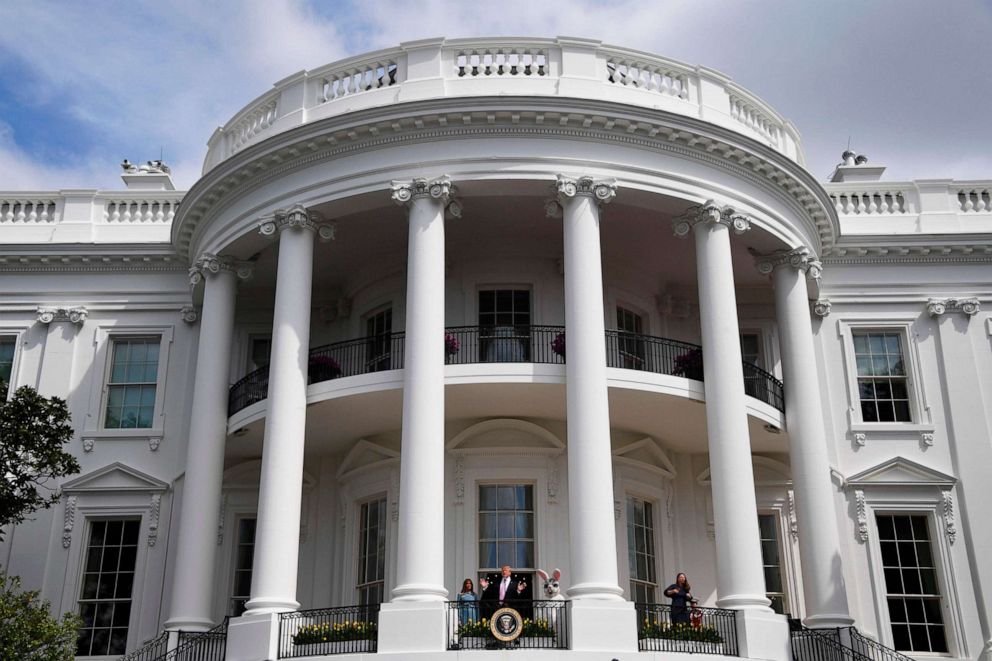 PHOTO: President Donald Trump speaks as First Lady Melania Trump looks on during the annual White House Easter Egg Roll on the South Lawn of the White House, April 22, 2019. 