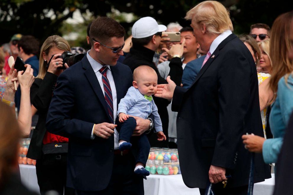 PHOTO:President Donald Trump, joined by first lady Melania Trump, right, greet guests on the South Lawn of the White House, April 22, 2019, during the annual White House Easter Egg Roll.