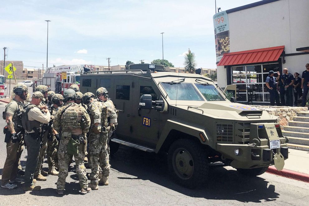 PHOTO: Armed Policemen gather next to an FBI armoured vehicle next to the Cielo Vista Mall as an active shooter situation goes on inside the Mall in El Paso, Texas, Aug., 03, 2019.