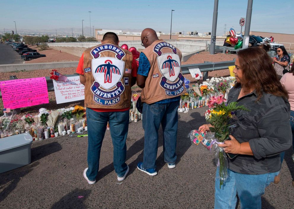 PHOTO: People pray at a makeshift memorial after the shooting that left at least 22 people dead at the Cielo Vista Mall WalMart in El Paso, Texas, Aug. 5, 2019.