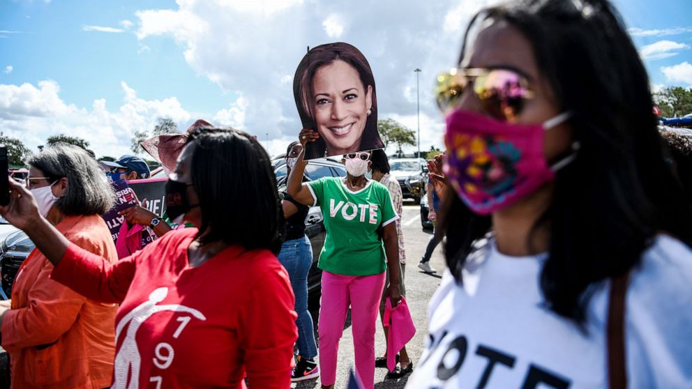 PHOTO: Supporters listen as Democratic vice presidential nominee Kamala Harris speaks during a drive-in rally at Florida International University in Miami, Oct. 31,2020.