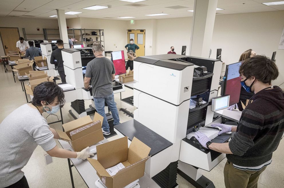 PHOTO: Workers wearing protective masks and gloves sort ballots at the Contra Costa County Clerk Office in Martinez, Calif., Oct. 27, 2020.