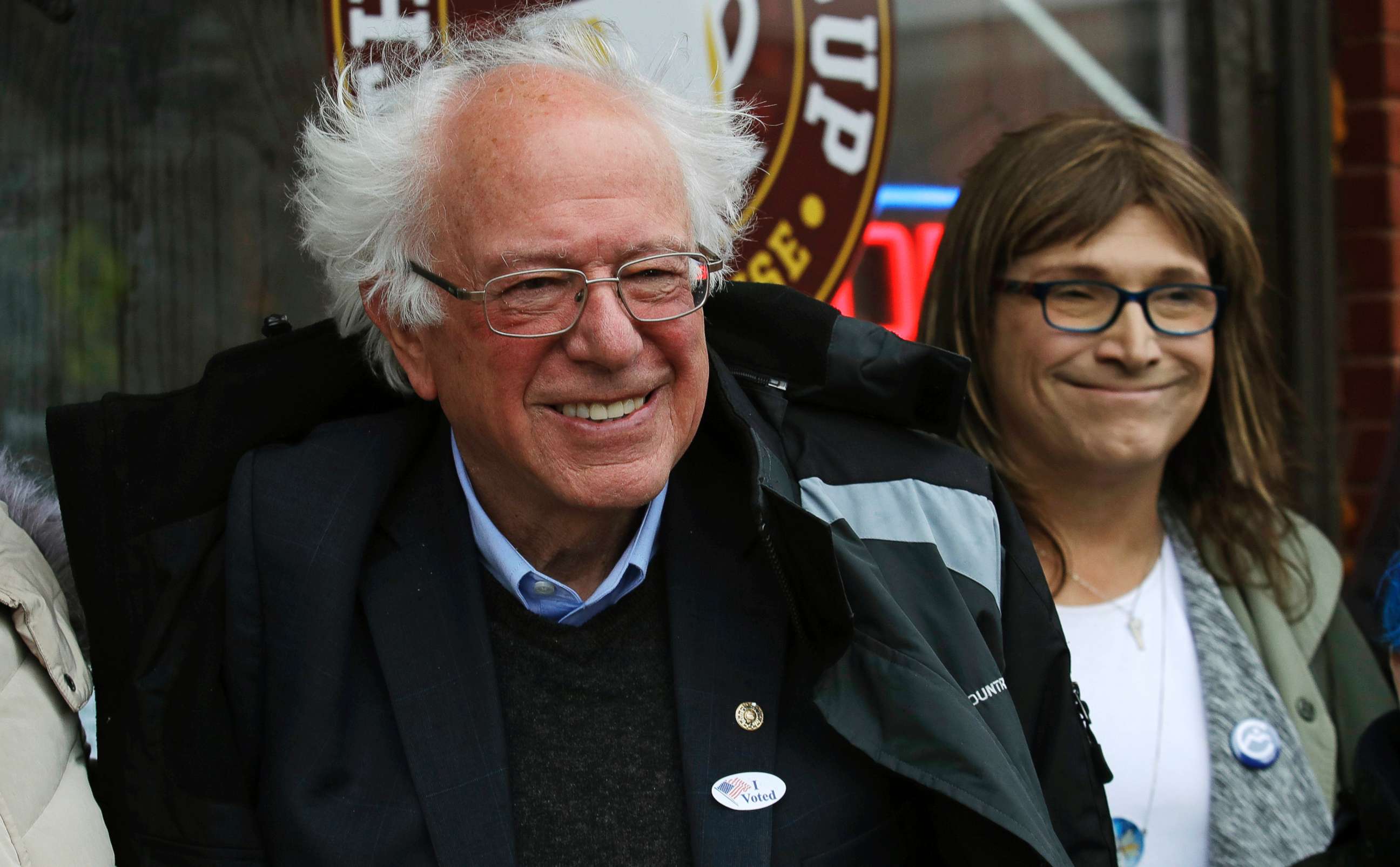 PHOTO: Sen. Bernie Sanders smiles as he poses for a photograph with Vermont Democratic gubernatorial candidate Christine Hallquist outside City Hall in Saint Albans, Vt., Nov. 6, 2018.