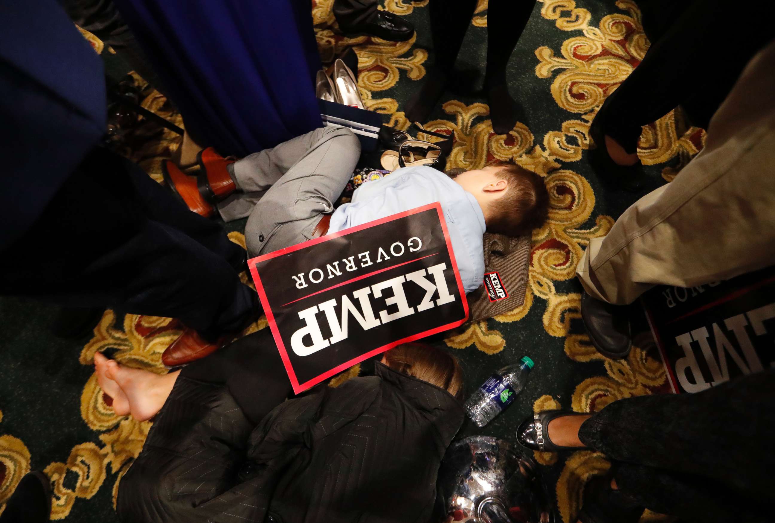 PHOTO: William Barrow, 8, of Griffin, Ga., sleeps early Wednesday morning, Nov. 7, 2018, during an election night party for Georgia Republican gubernatorial candidate Brian Kemp, in Athens Ga.