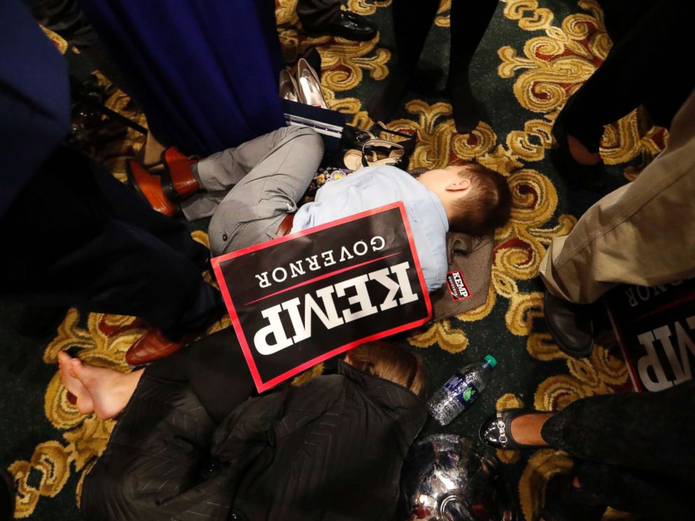 PHOTO: William Barrow, 8, of Griffin, Ga., sleeps early Wednesday morning, Nov. 7, 2018, during an election night party for Georgia Republican gubernatorial candidate Brian Kemp, in Athens Ga.