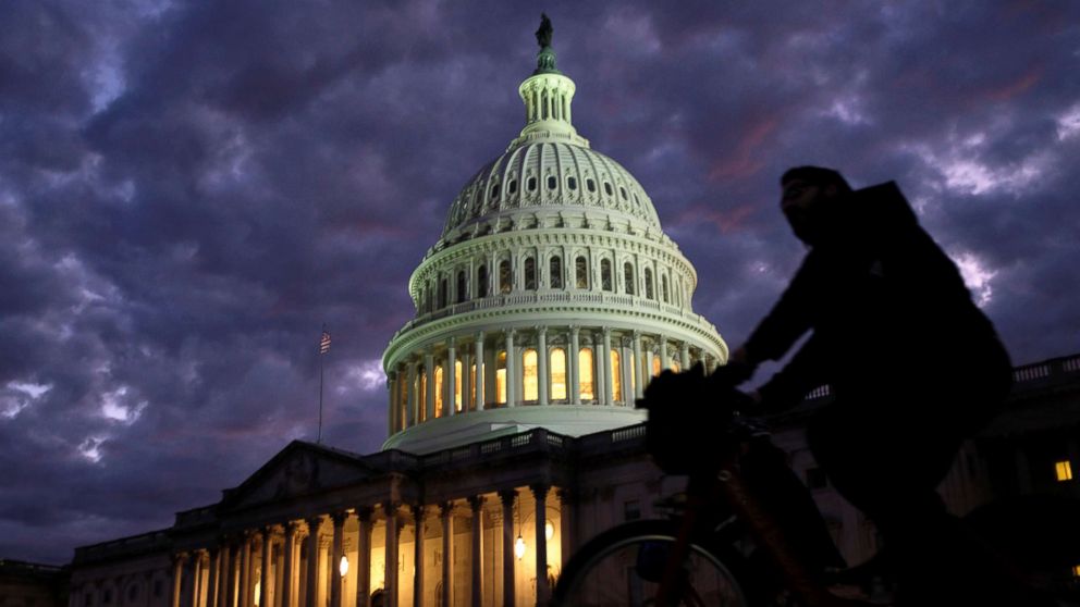 PHOTO: Cyclists ride past the U.S. Capitol dome in Washington on midterm election day, Nov. 6, 2018.