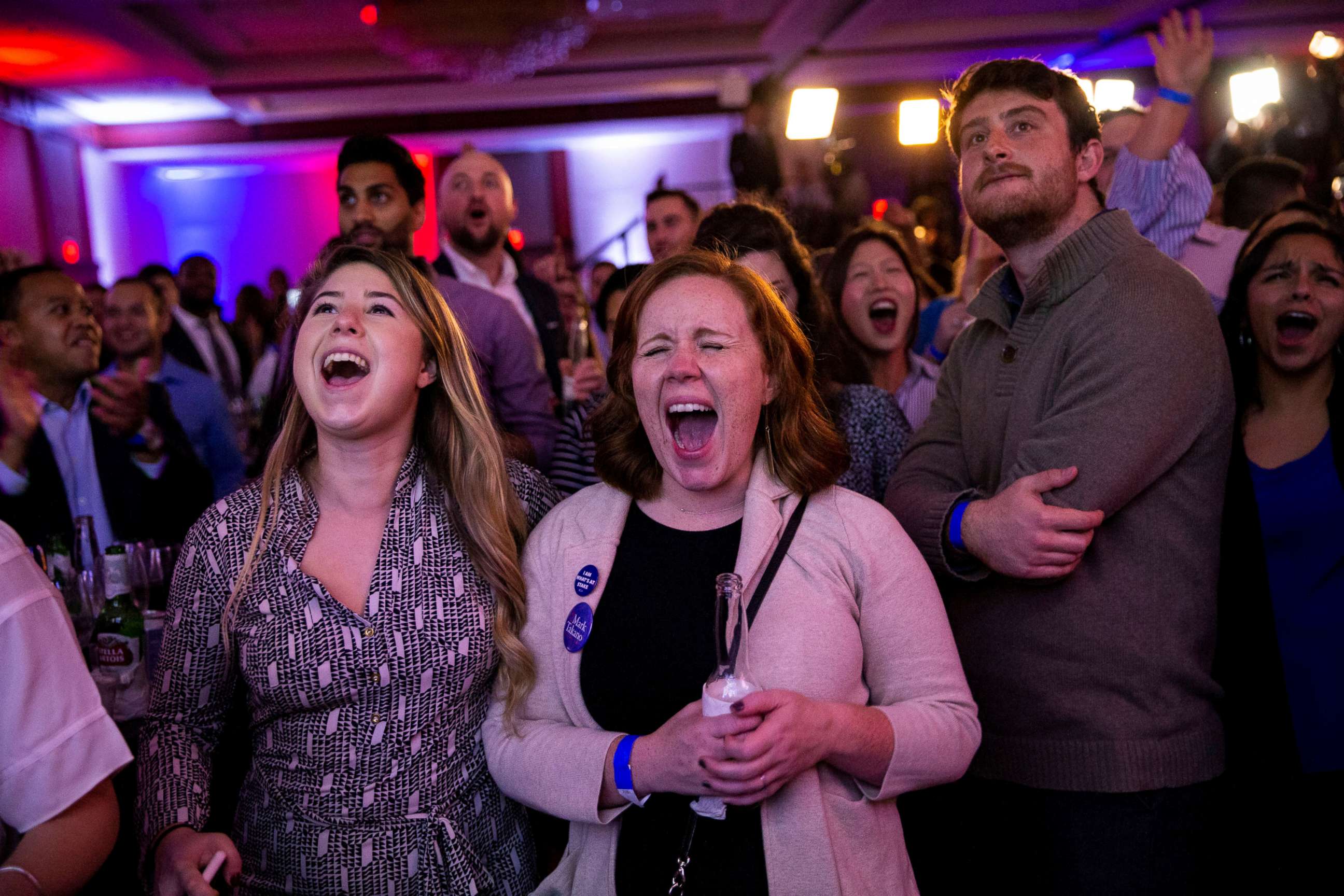 PHOTO: Alyssa Giammarella and Claire Viall cheer as they watch election results come in at a Democratic election night rally in Washington, Nov. 6, 2018.