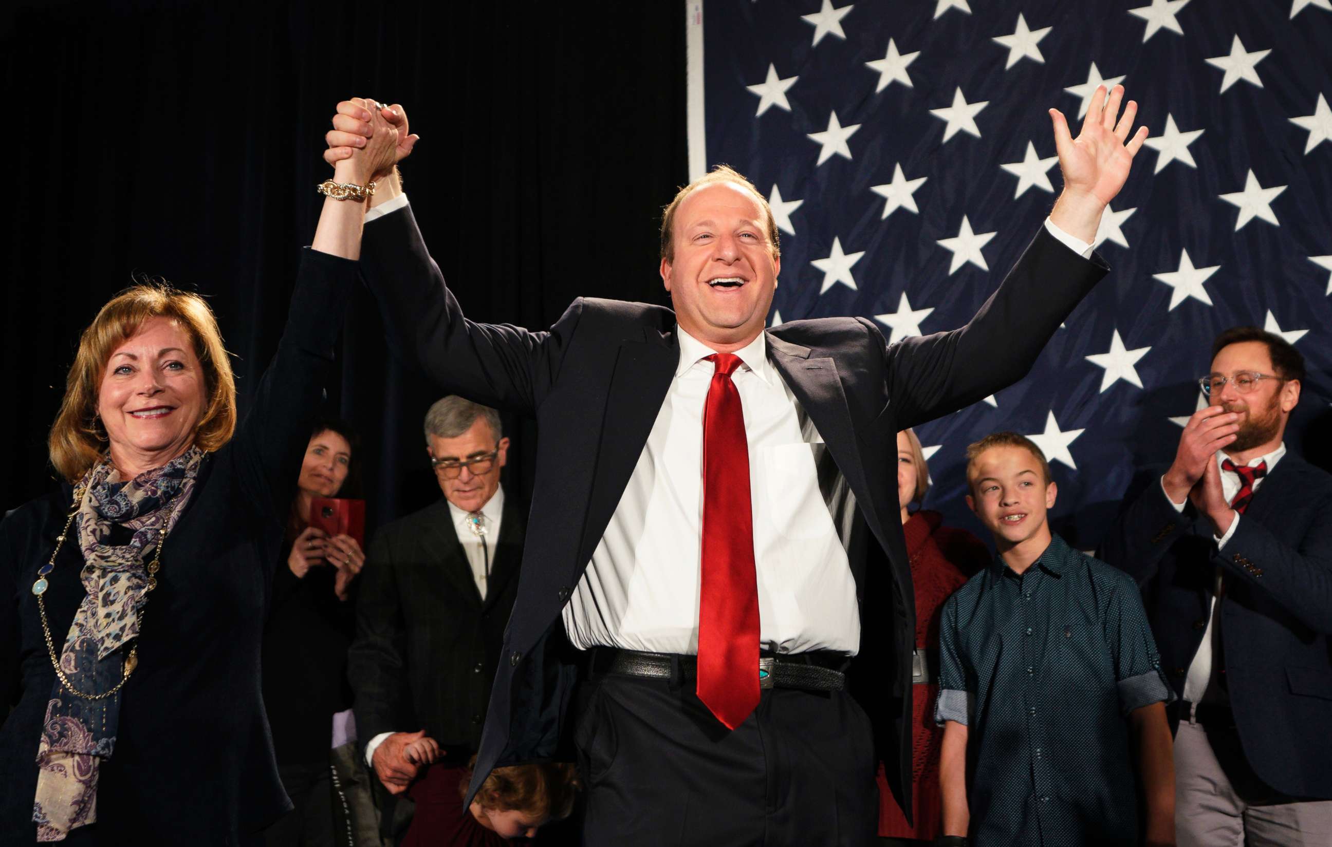 PHOTO: Democratic Colorado Governor-elect Jared Polis arrives onstage with running mate Dianne Primavera on Nov. 6, 2018 in Denver.