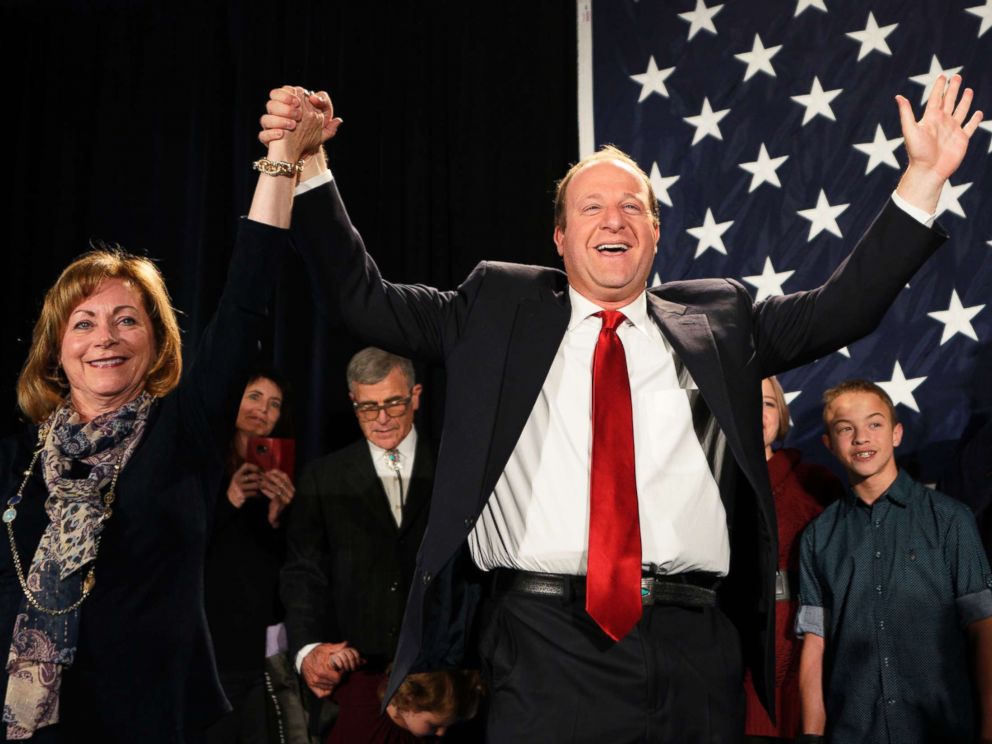 PHOTO: Democratic Colorado Governor-elect Jared Polis arrives onstage with running mate Dianne Primavera on Nov. 6, 2018 in Denver.