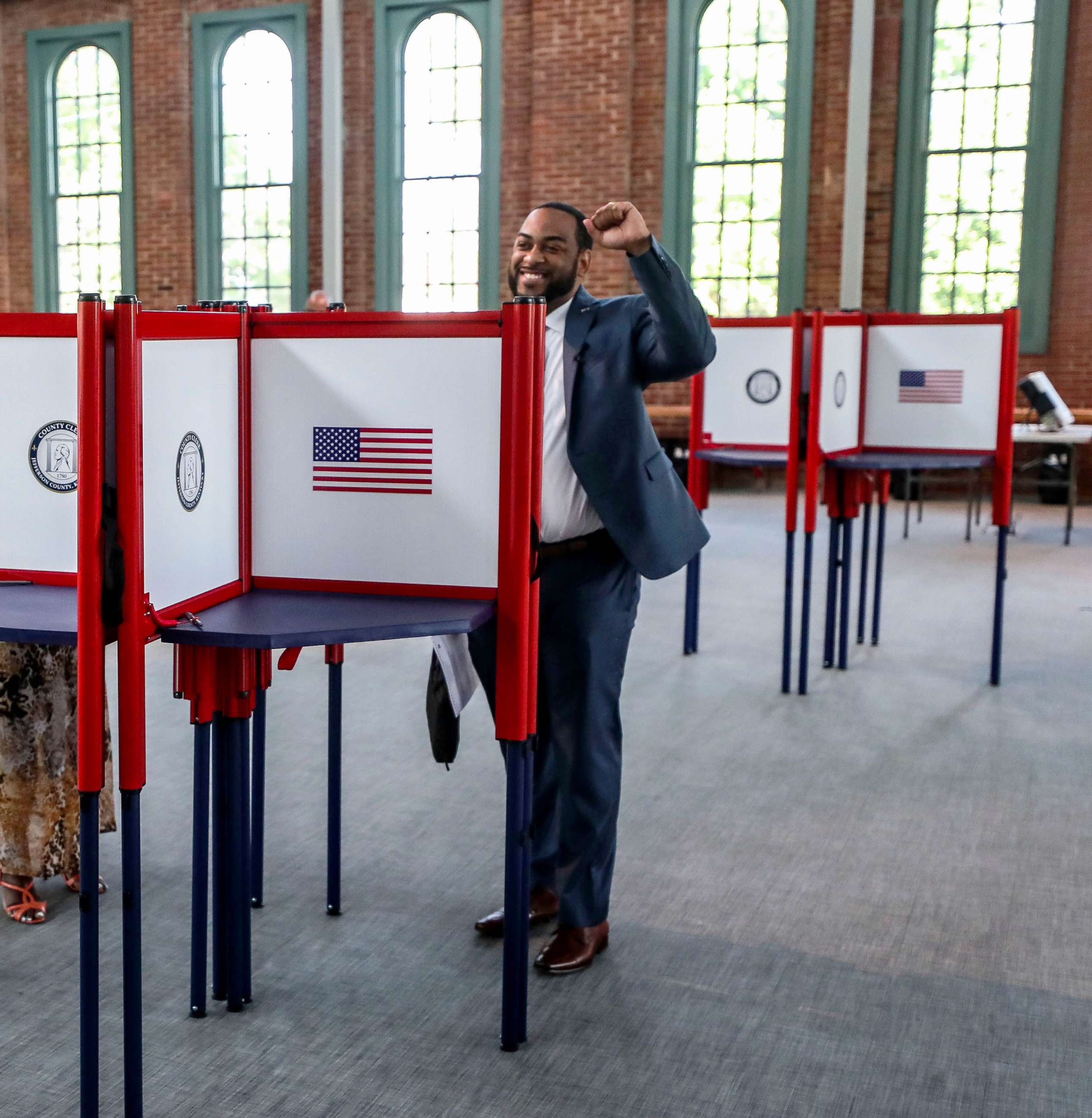 PHOTO: Rep. Charles Booker raises his fist after voting in the Kentucky primary Thursday morning at a polling station at the Kentucky Center for African American Heritage in Louisville, Ky., May 12, 2022.