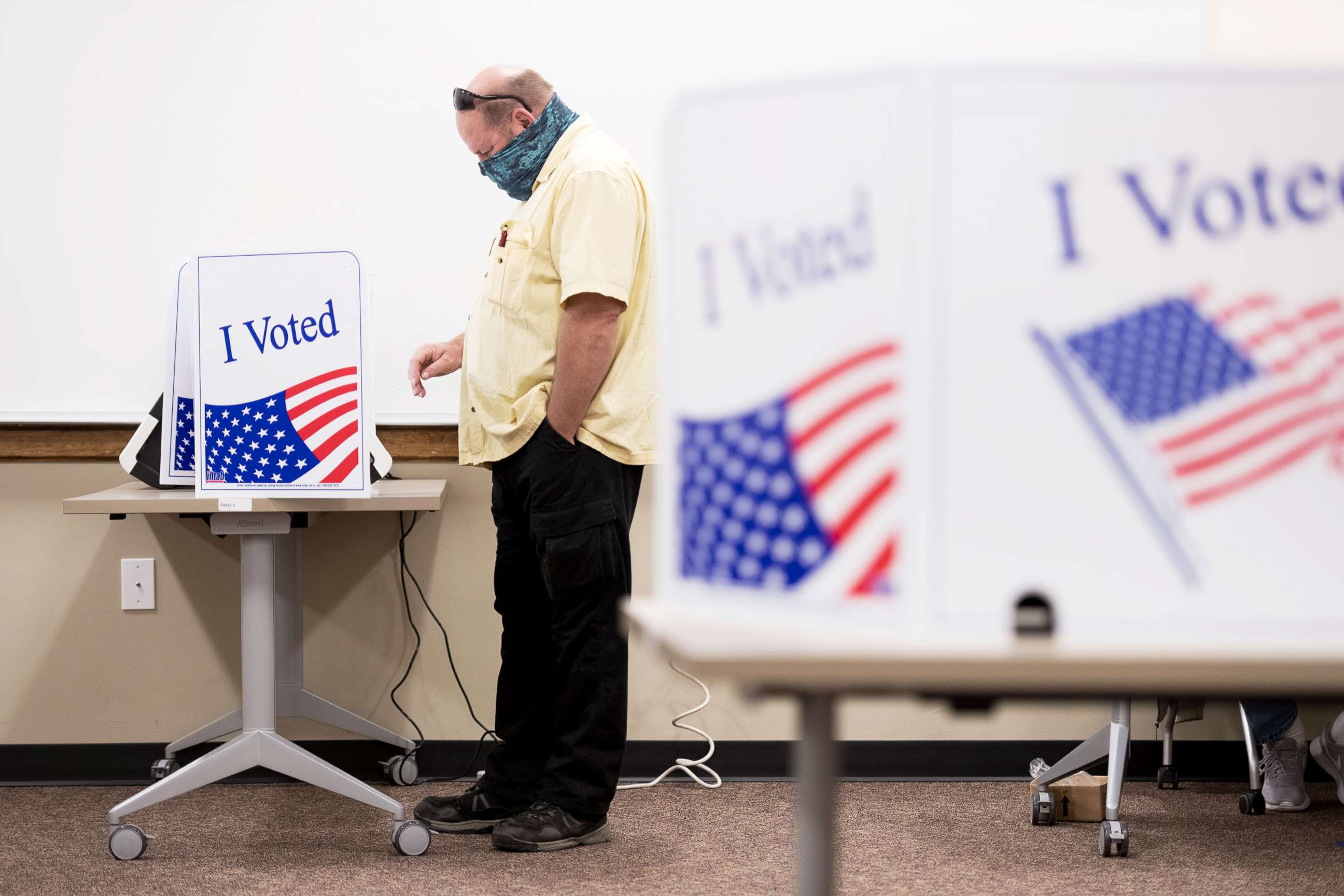 PHOTO: A voter casts his ballot at the Lexington County Voter Registration & Elections Office on the second day of in-person absentee and early voting in Lexington, S.C., Oct. 6, 2020. 