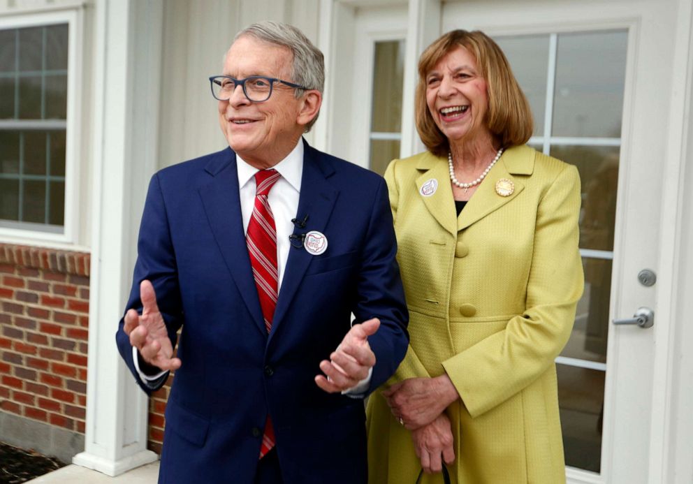 PHOTO: Ohio Gov. Mike DeWine, left, and Ohio first lady Fran DeWine meet with reporters outside of their polling place after voting in Cedarville, Ohio, May 3, 2022. 